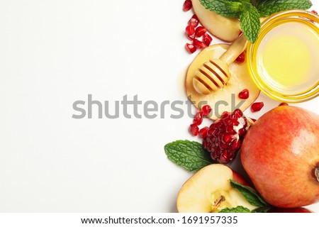 Apple, pomegranate and honey on white background. Home treatment