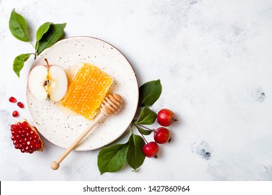 Apple, pomegranate and honey, traditional food of jewish New Year - Rosh Hashana. Copy space background - Powered by Shutterstock