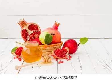 Apple, pomegranate and honey, traditional food of jewish New Year - Rosh Hashana. Copy space background - Powered by Shutterstock