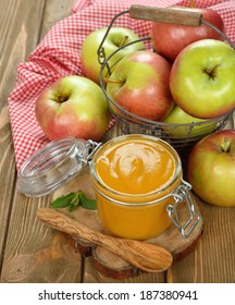 Apple Sauce In A Jar On A Brown Background