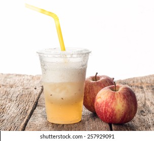 Apple shake with fresh apple on old wood table