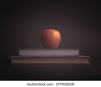 Apple sitting on pile of books