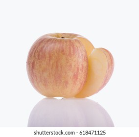 Apple with slice on white background.