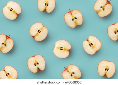 Apple Slices Pattern On A Blue Background. Repetition Concept. Top View. Flat Lay