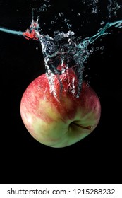 Apple Spash In Water On Black Background