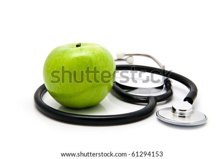 apple and stetoskop on a white background