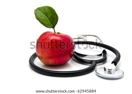 apple and stetoskop on a white background