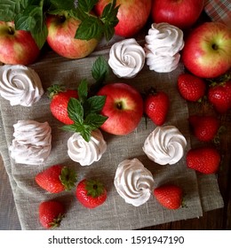 Apple and strawberry marshmallows on burlap