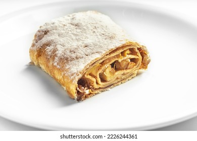 Apple strudel sweet cake on a white plate