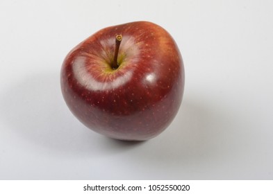 An apple is a sweet, edible fruit produced by an apple tree. 