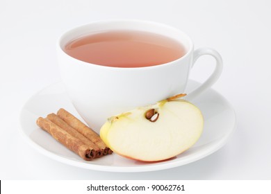 Apple tea with cinnamon on white background. Shallow dof - Powered by Shutterstock
