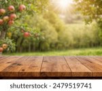 Apple tree background, wooden table top on super blurred background. used for display or wooden montage as your dining background. banners, boards, podiums