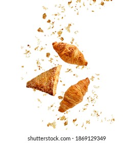 Apple Turnover, French Butter And Almond Nut Croissants Flying With Crumbs Isolated On White Background. 