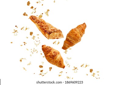 Apple Turnover, French Butter And Almond Nut Croissants Flying With Crumbs Isolated On White Background. 