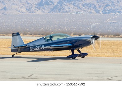 APPLE VALLEY, CA/USA - OCTOBER 12, 2019: image of Extra EA-300 aerobatic plane with registration N521DW shown taxiing at the Apple Valley Airport.