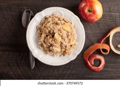 Apple Walnut Cinnamon Oatmeal Top View On Dark Wood