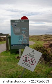Applecross, Scotland, UK - May 15 2022: Signage at Sands beach near Applecross on the NC500, Scottish Highlands. Map of area and sign for no littering and no human waste. Blurred background.
