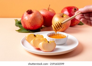 Apples And Honey Closeup For Jewish Holiday Rosh Hashanah With Pomegranate In Background