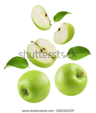 Apples isolated. Levitation of ripe green apples, apple halves and slices on a white background.