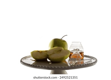 apples and jar of honey on white plate background. Rosh Hashanah greeting card (Jewish New Year holiday) concept. - Powered by Shutterstock