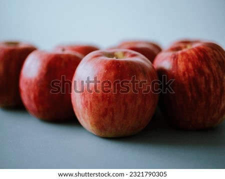 Apples on a lightblue table