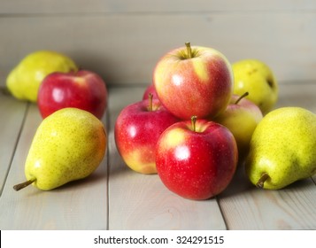 
Apples and pears on a wooden background