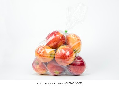 Apples in plastic bag on white background - Shutterstock ID 682610440
