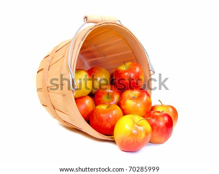 Apples in a wooden farmer's basket, isolated