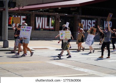 Appleton, Wisconsin / USA - July 11th, 2020: Black lives matter and lgbt individuals held a rally at houdini plaza and marched to appleton police department to protest against police brutality. 
