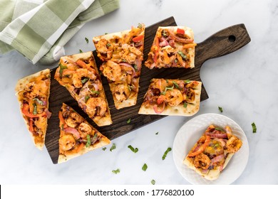 Applewood Smoked BBQ Shrimp Flatbread Pizza On A Cutting Board Ready For Eating.