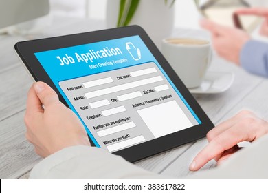 Applicant Filling Up The Online Job Application By Digital Tablet.