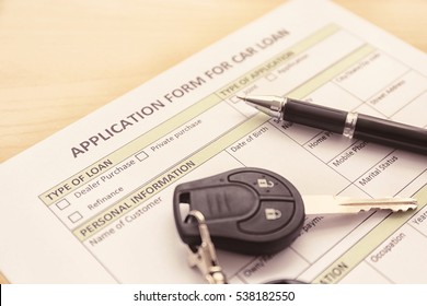 Application Form For Car Loan, Pen And Key On Wooden Table, Close Up View