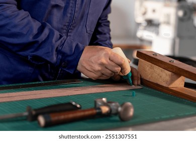 application of glue to the leather, creation of a leather handicraft - Powered by Shutterstock