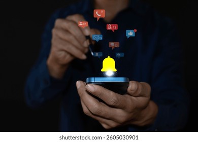 Application notification concept of man using smartphone with various application notification icons, showing icons on virtual screen.