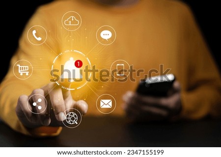 Application notification concept, Smartphone user touching notification bell icon, social media alert symbol.