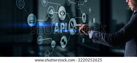 Application Programming Interface. API software development tool. Information technology concept. Businessman presses API text icon on a virtual interface