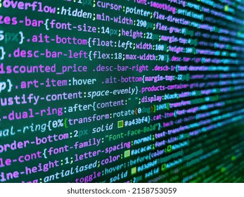 Application web source code on monitor. Information technology website coding standards for web design. Programmer workplace. Web development code: CSSSASS styles preprocessor script lines