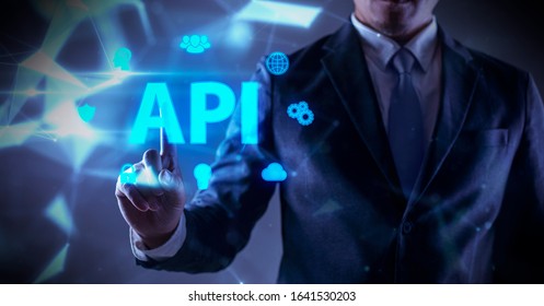 Applications Program Interface ,businessman is touching hologram API technology. 