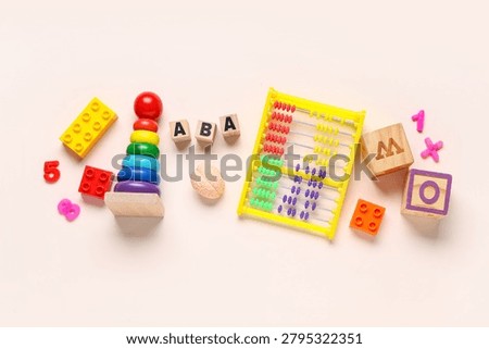 Applied behavior analysis therapy with colorful educational toys abacus and alphabet blocks for child development, these items are used for child development learning and cognitive skill building