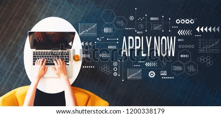 Apply now with person using a laptop on a white table