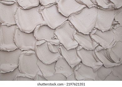 Applying Cement Plaster In A Thick Layer On A Concrete Wall By A Preliminary Method