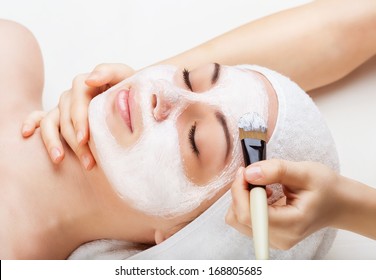 Applying Facial Mask At Woman Face At Beauty Salon