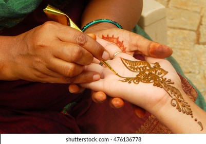 Applying henna or Mehandi a temporary tattoo in India during celebrations and other times                                     