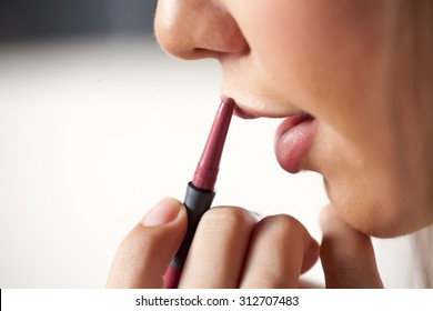 applying a lip liner - Powered by Shutterstock