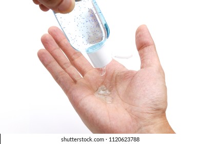 Applying lotion containing microplastics. Microplastics are environmentally harmful and have been banned from use in some countries.