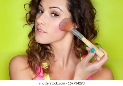 Applying make up concept, woman with cosmetic brush