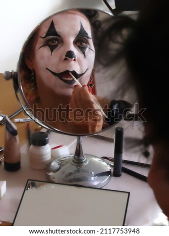 Applying makeup for the local Halloween festival