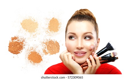 Applying Make-up. Woman with a brush for make-up.Shades of makeup powder on white background.