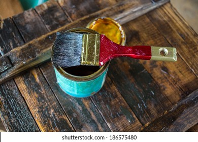 Applying Protective Varnish On A Wooden Old Vintage Furniture