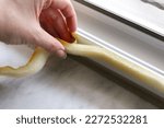 applying sponge tape or window seal to the PVC window for heat insulation
